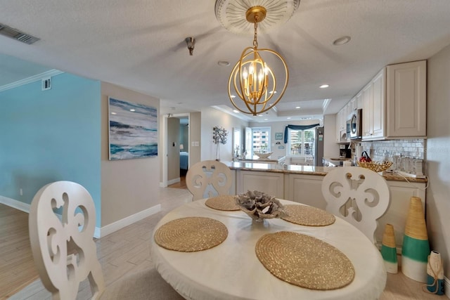 18325 Gulf Blvd Unit 407, Redington Shores, FL 33708 - dining room with a chandelier, recessed lighting, and baseboards