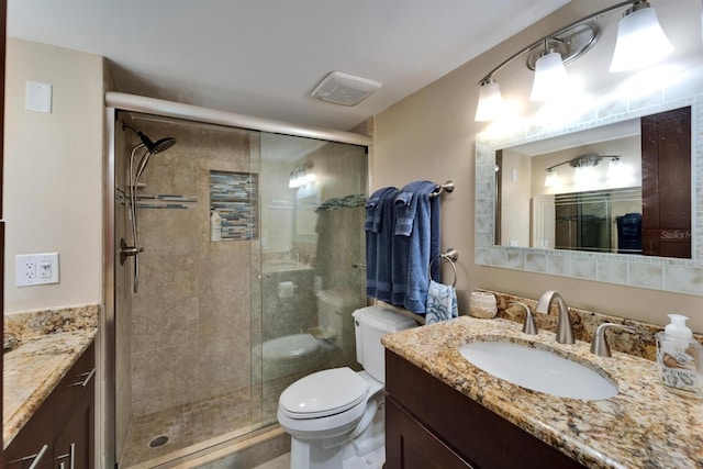 18325 Gulf Blvd Unit 407, Redington Shores, FL 33708 - full bathroom with vanity, toilet, and a shower stall