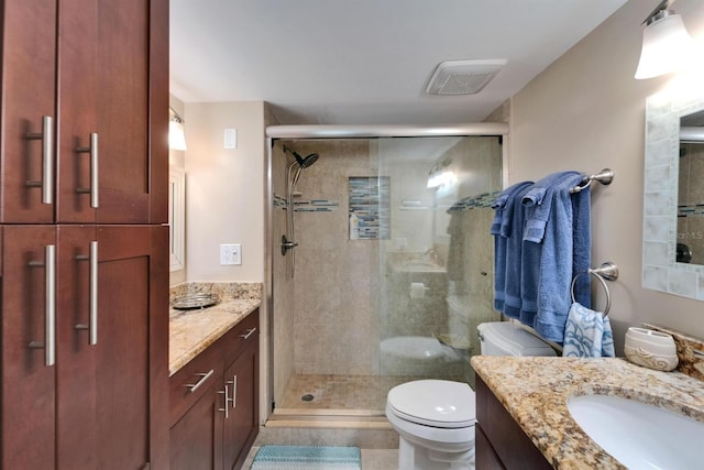 18325 Gulf Blvd Unit 407, Redington Shores, FL 33708 - full bathroom with a stall shower, vanity, and toilet