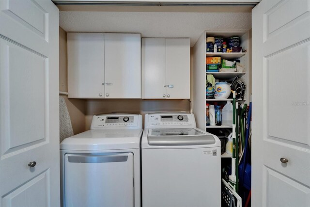 18325 Gulf Blvd Unit 407, Redington Shores, FL 33708 - laundry room with washer and dryer and cabinet space
