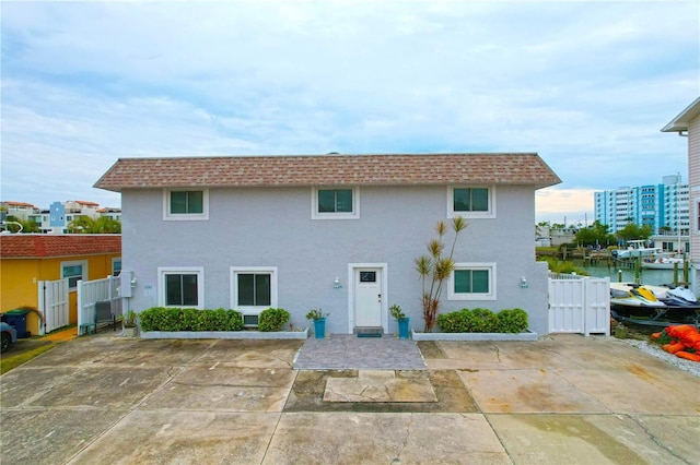 back of house with a water view