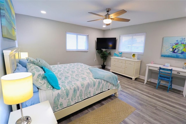 bedroom featuring ceiling fan and light hardwood / wood-style floors