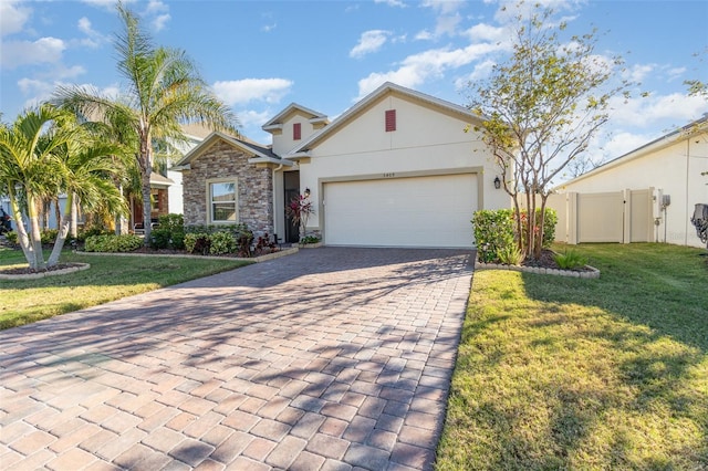 view of front of home with a front lawn and a garage