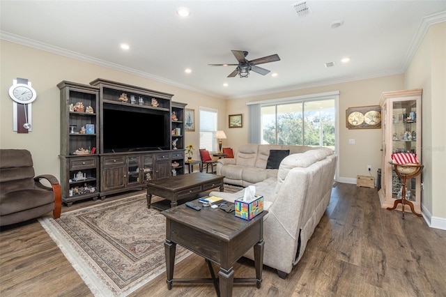 living room featuring ceiling fan, dark hardwood / wood-style floors, and ornamental molding