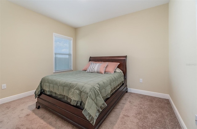 bedroom featuring light colored carpet