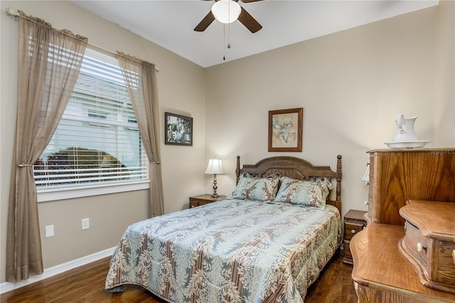 bedroom with ceiling fan and dark hardwood / wood-style flooring