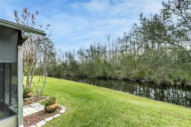 view of yard with a water view