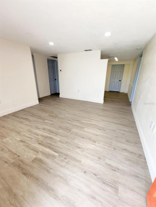 unfurnished room featuring light hardwood / wood-style flooring