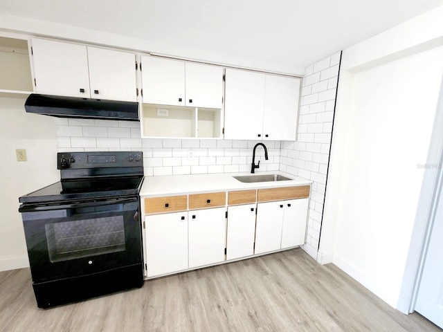 kitchen featuring backsplash, white cabinets, sink, and black electric range oven