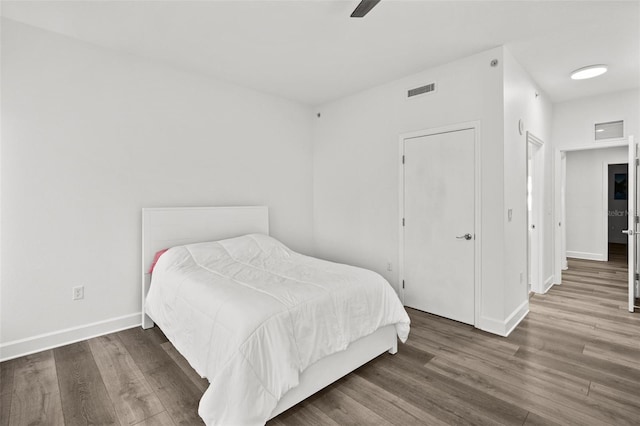 bedroom featuring ceiling fan and dark hardwood / wood-style flooring