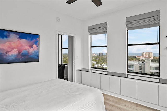 bedroom with light wood-type flooring and ceiling fan