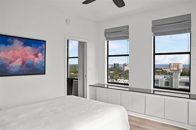 bedroom featuring ceiling fan and light hardwood / wood-style flooring