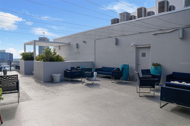 view of patio featuring central AC unit and an outdoor living space