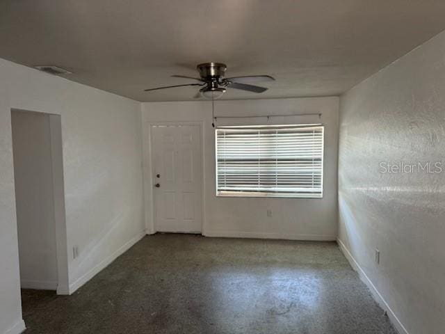 unfurnished room with ceiling fan