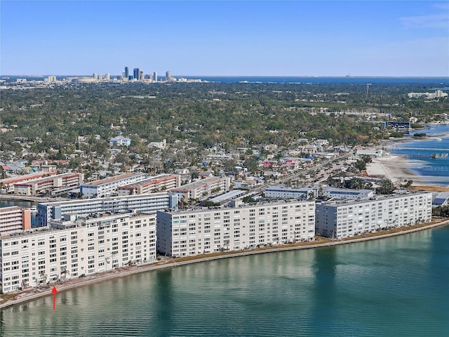 birds eye view of property with a view of city and a water view