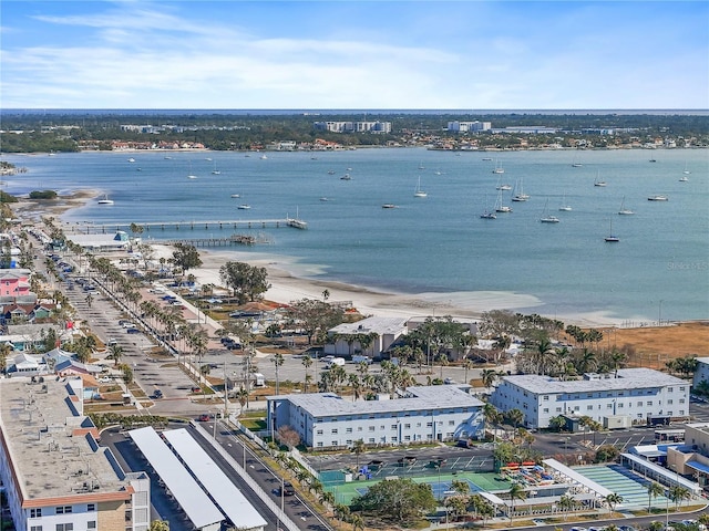 birds eye view of property with a view of the beach and a water view