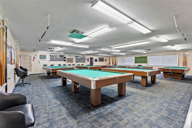 playroom with pool table, a textured ceiling, and carpet flooring