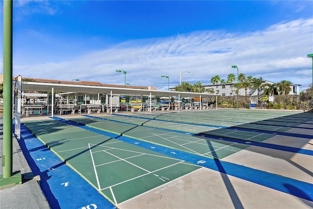 view of property's community featuring shuffleboard