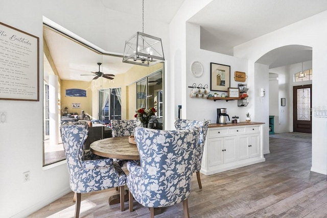 dining area featuring hardwood / wood-style flooring and ceiling fan