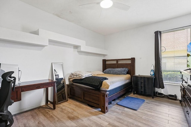 bedroom with light hardwood / wood-style floors and ceiling fan