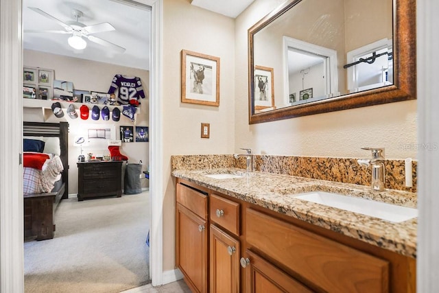 bathroom with ceiling fan and vanity