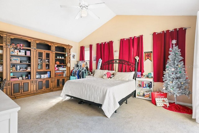 carpeted bedroom with ceiling fan and lofted ceiling