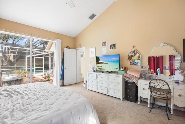 bedroom featuring access to exterior, light carpet, and high vaulted ceiling