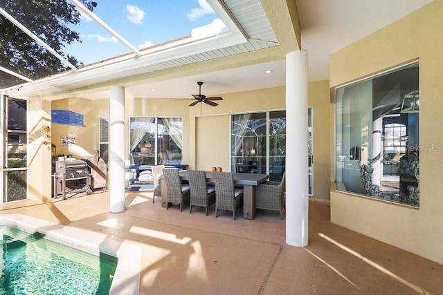 view of patio / terrace with a lanai and ceiling fan