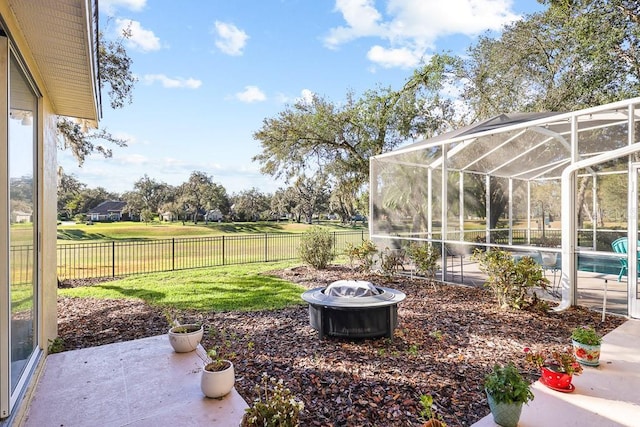 view of yard featuring a lanai, a patio area, and a fenced in pool