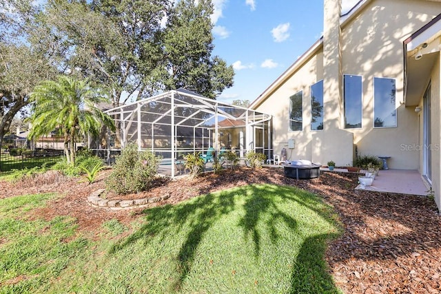 view of yard featuring glass enclosure