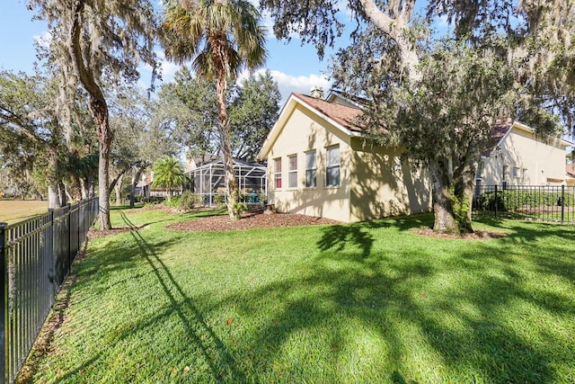 view of yard with a lanai