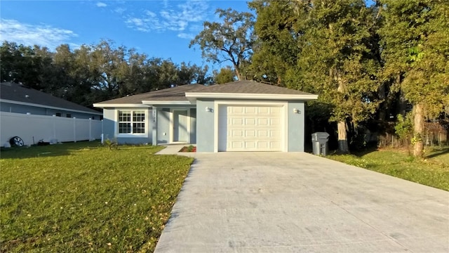 ranch-style house featuring a front lawn and a garage