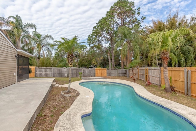 view of swimming pool featuring a patio area