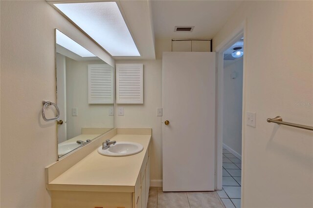 bathroom featuring tile patterned floors and vanity