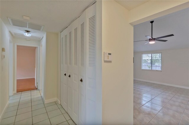 corridor with light tile patterned floors