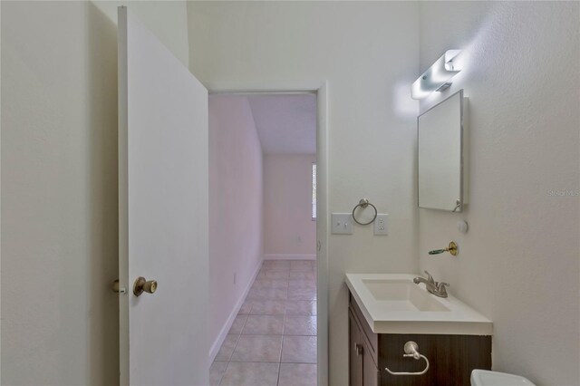 bathroom featuring tile patterned floors and vanity