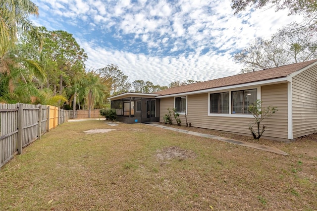 view of yard with a sunroom