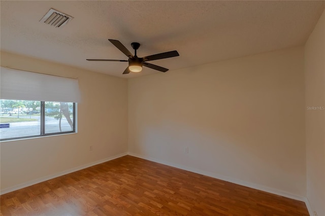 102 Shoreview Ln, Oldsmar, FL 34677 - unfurnished room with wood finished floors, a ceiling fan, and baseboards
