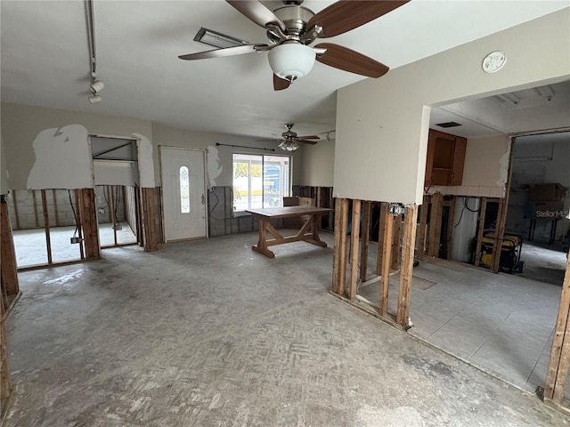 interior space featuring ceiling fan