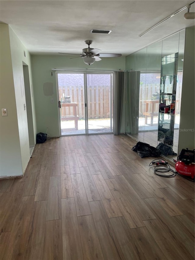 empty room featuring ceiling fan and wood-type flooring