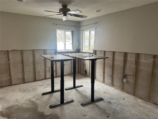 unfurnished dining area featuring ceiling fan