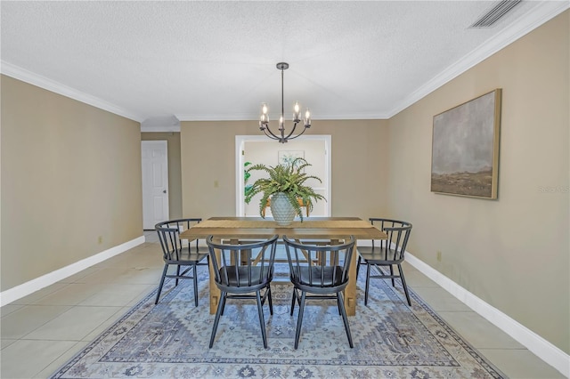 tiled dining room with crown molding, a textured ceiling, and an inviting chandelier