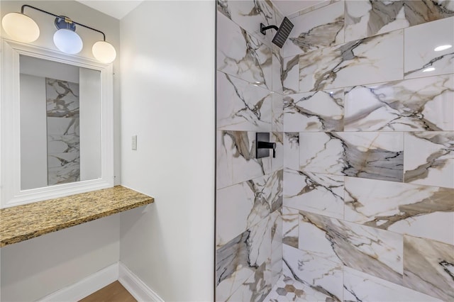 bathroom featuring tiled shower