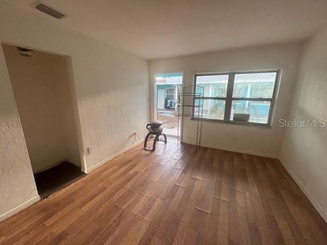 unfurnished room featuring wood-type flooring