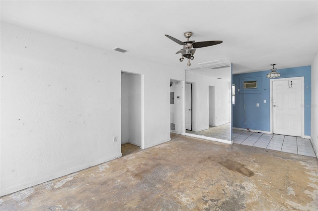 unfurnished room featuring a ceiling fan, baseboards, and a wall mounted air conditioner