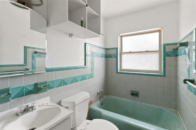full bathroom featuring a sink, a bathtub, tile walls, toilet, and a shower
