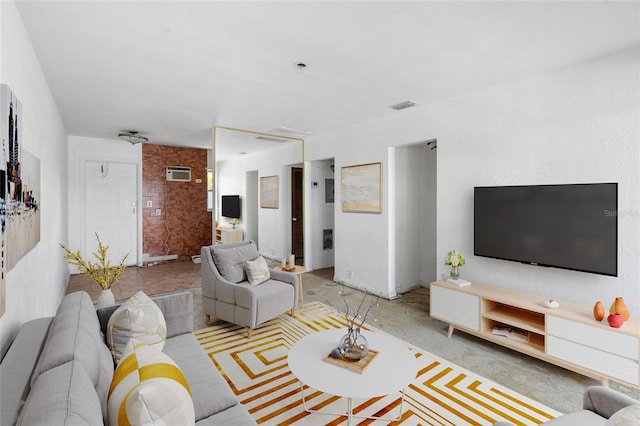living area featuring a wall mounted AC