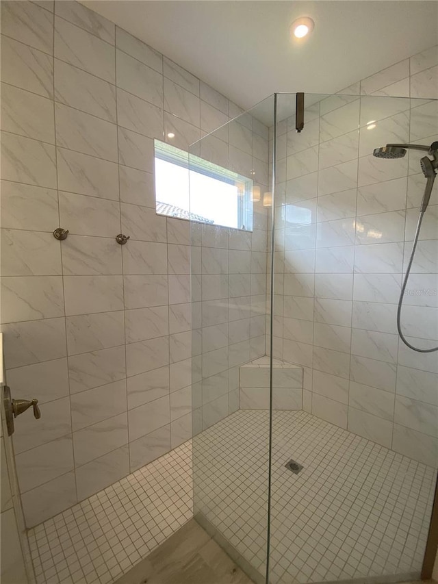 bathroom featuring an enclosed shower