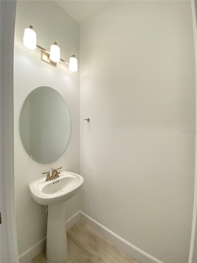 bathroom featuring wood-type flooring