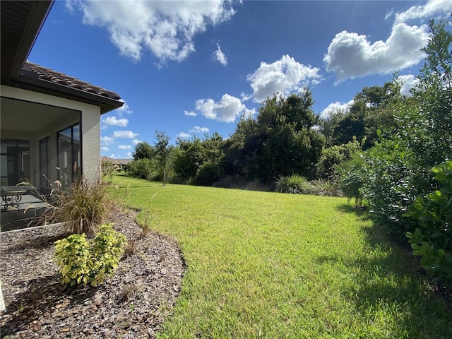 view of yard featuring a sunroom